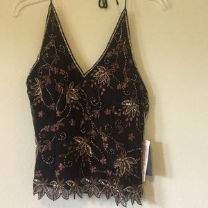 Beautiful Halter style beaded top, laces up back.